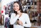 woman selecting different earrings