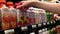 Woman selecting fresh juice in grocery store