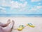 Woman selfie barefoot and yellow sandals on the beach