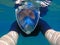 Woman selfie underwater. Young girl swimming under water in modern snorkeling gear.