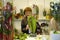 Woman seller arranging bouquet of flowers at the counter of the flower shop. Kyiv, Ukraine