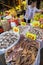 Woman selling dried seafood at a street market in Hong Kong