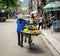 A woman selling fruits on bike in Halong, Vietnam