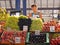 Woman selling fruits at Komarovsky marketplace in Minks Belarus