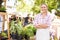 Woman Selling Herbs And Plants At Farmers Food Market