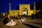 Woman selling skull caps in front of Mosque