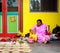 A woman selling souvenirs on street in Melaka, Malaysia