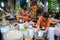 A woman selling spices at local market in Delhi, India