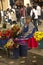 A woman sells flowers on a street in Cuenca, Ecuador.