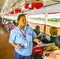 Woman sells tickets on a ferry on the river Chao Phraya in Bangkok