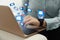 Woman sending emails at table, closeup