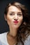 Woman with sensual kiss smile