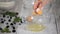 Woman separating egg yolk from white in kitchen, close-up.