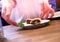 Woman serving apple pie on the white plate