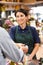 Woman serving customer in florist