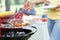 Woman serving grilled steak