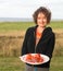 Woman serving lobster at beach