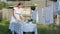 Woman sets the table in the backyard.