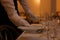 Woman setting table in restaurant, closeup. Professional butler courses