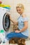 Woman setting washing machine