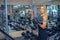 Woman shakes her biceps at gym