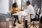 Woman Shaking Hands With Male Doctor In Hospital Office Consultation