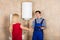 Woman Shaking Hands With Male Plumber