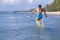 Woman shape large and bikini blue jump on wave at beach