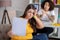 Woman with sheet of paper twisted her face, serious nutritionist behind.