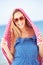 Woman Sheltering From Sun On Beach Holiday