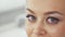 Woman shifts her gaze at the cosmetology salon