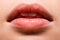 Woman with shiny lip gloss on lips