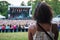 woman with shiny locks attending outdoor concert