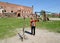 A woman shoots archery on the grounds of Shaaken Castle. Kaliningrad region