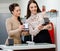 Woman and shop assistant choosing jewellery