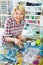 Woman in shop with sewing goods