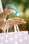 Woman shopper disinfecting hands with sanitiser