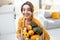 Woman with shopping bag full of fresh food indoors