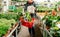 Woman shopping for flowers in German supermarket