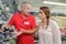 Woman shopping for hammer drill in hardware store