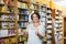 Woman shopping health supplements in drugstore