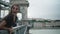 Woman is shouting jokingly on bridge in Budapest