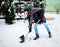 woman with shovel cleaning snow. Winter shoveling. Removing snow after blizzard