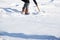 Woman shovelling snow to clear her driveway after winter storm