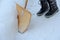 A woman shovels the snow away with a snow shovel