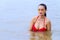 Woman show beautiful breast with red bikini on beach