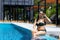 Woman show happy relax bikini in swimming pool