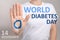 Woman showing blue circle drawn on palm against light background, closeup. World Diabetes Day