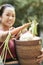 Woman showing fresh carrot