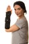 Woman showing hand in orthosis